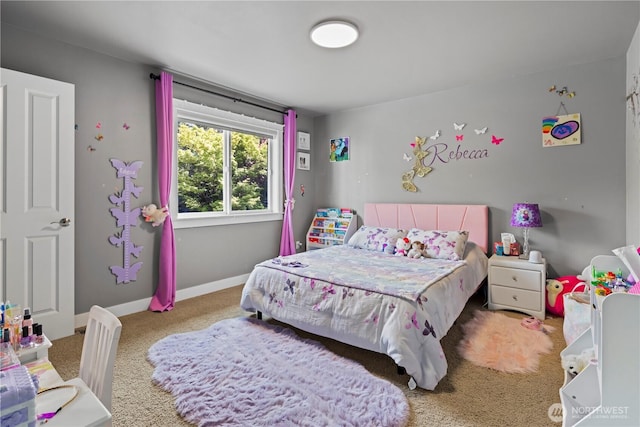 carpeted bedroom with baseboards