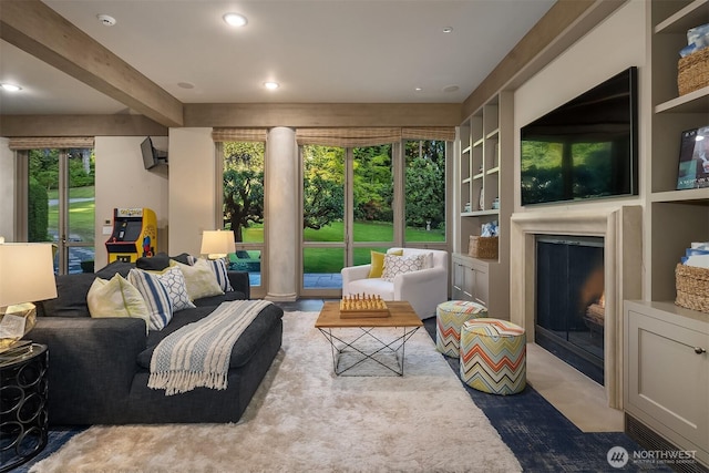 107 NW Highland Dr, Seattle, WA 98177 - living room with a glass covered fireplace, healthy amount of natural light, ornate columns, beamed ceiling, and recessed lighting