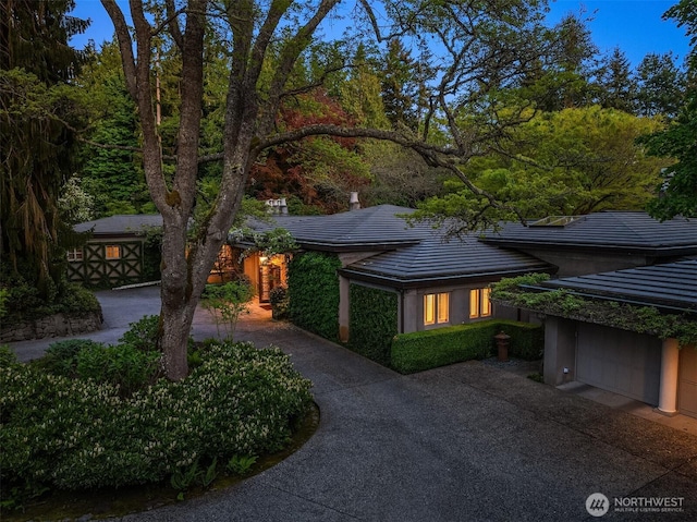 107 NW Highland Dr, Seattle, WA 98177 - view of front of property with driveway, a tile roof, and a garage