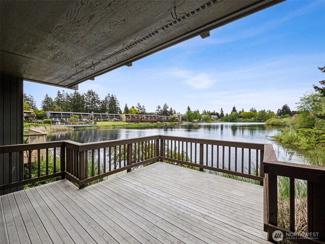 wooden deck with a water view