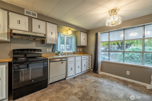 211 Pace Dr Unit 16, East Wenatchee, WA 98802 - kitchen with white dishwasher, black / electric stove, under cabinet range hood, and white cabinets