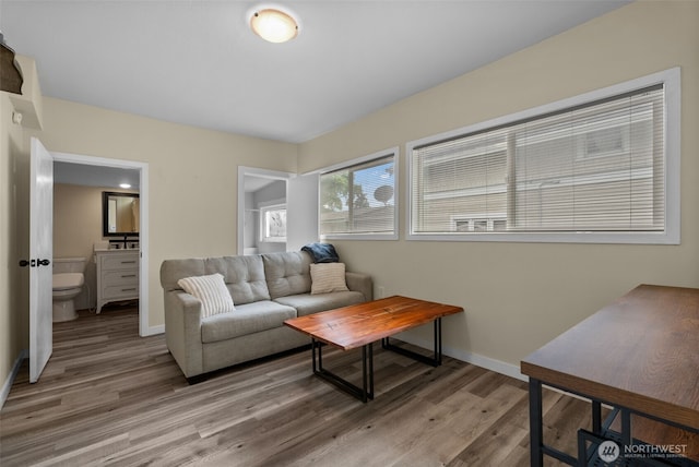 living room featuring light wood-style floors and baseboards