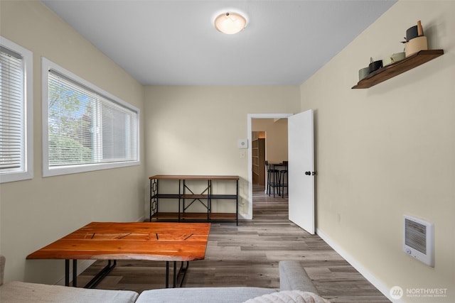 sitting room with wood finished floors and baseboards