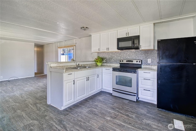 kitchen featuring black appliances, a peninsula, dark wood-style floors, white cabinets, and a textured ceiling