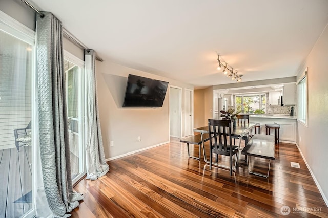 1851 58th St NE, Tacoma, WA 98422 - dining room featuring dark wood-style flooring and baseboards