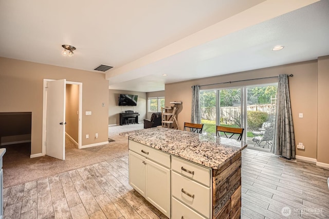 1851 58th St NE, Tacoma, WA 98422 - kitchen featuring light wood-type flooring, open floor plan, light stone counters, baseboards, and recessed lighting