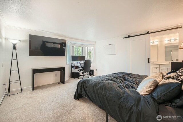 1851 58th St NE, Tacoma, WA 98422 - bedroom featuring light carpet, ornamental molding, baseboards, a barn door, and connected bathroom