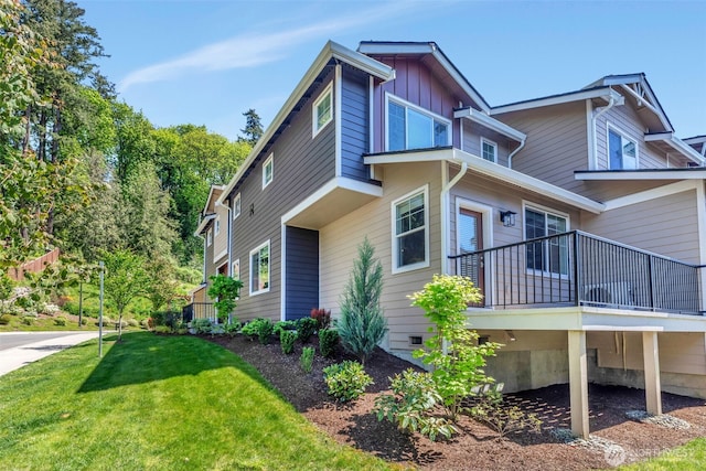 view of home's exterior with a lawn