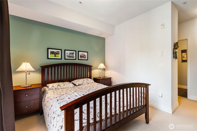 carpeted bedroom with baseboards