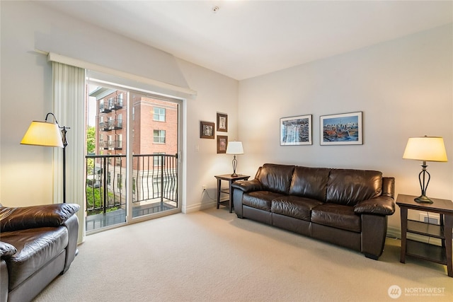 living area with carpet floors and baseboards