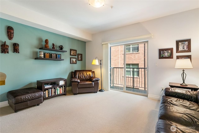 living area with carpet flooring and baseboards