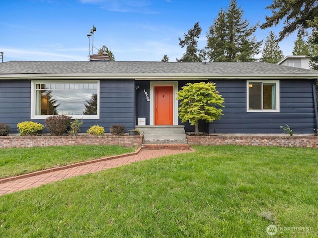 single story home featuring a front lawn, a chimney, and roof with shingles