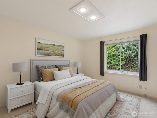 bedroom featuring light colored carpet