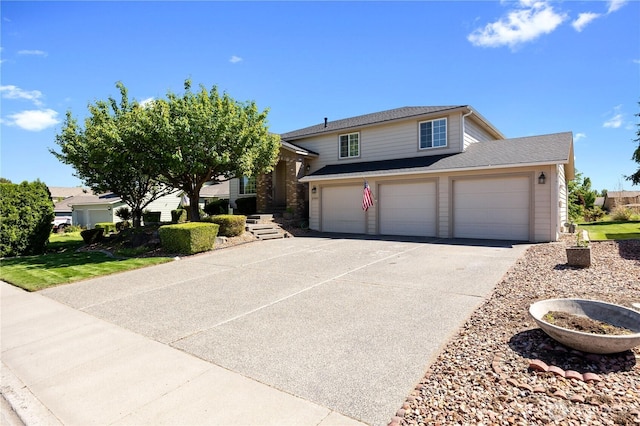 2983 Sonoran Dr, Richland, WA 99354 - view of front facade with concrete driveway and a garage