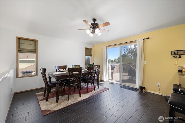 2983 Sonoran Dr, Richland, WA 99354 - dining space featuring baseboards, a ceiling fan, and dark wood-type flooring