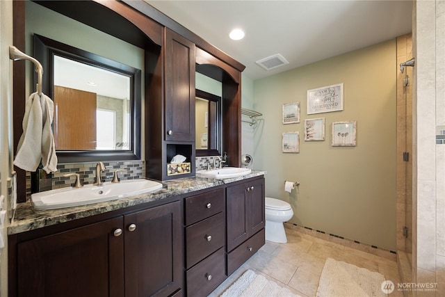 2983 Sonoran Dr, Richland, WA 99354 - full bath with a sink, double vanity, decorative backsplash, and visible vents
