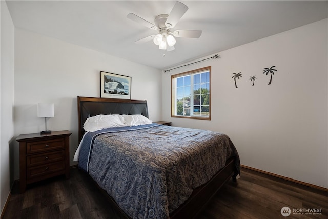 2983 Sonoran Dr, Richland, WA 99354 - bedroom featuring baseboards, ceiling fan, and dark wood-type flooring