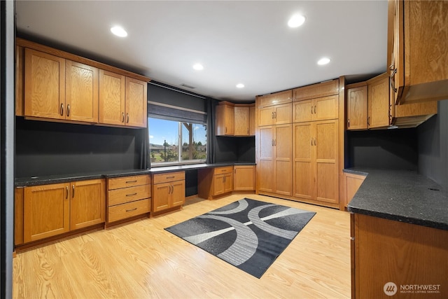 2983 Sonoran Dr, Richland, WA 99354 - kitchen featuring brown cabinetry, light wood finished floors, recessed lighting, and built in study area