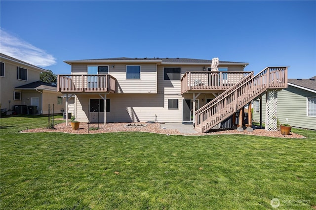 2983 Sonoran Dr, Richland, WA 99354 - back of property with a lawn, stairway, a wooden deck, and central AC