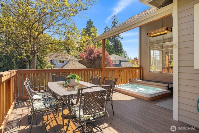 wooden terrace with outdoor dining area