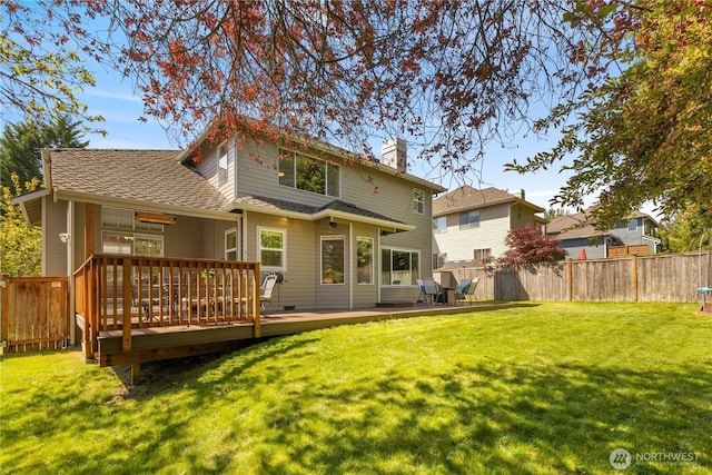 back of property with a deck and a chimney