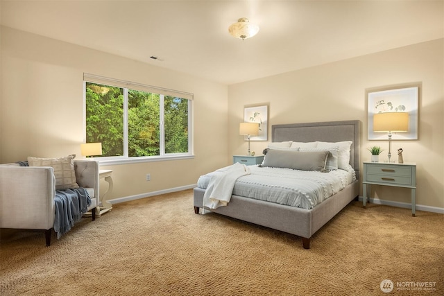 carpeted bedroom with baseboards