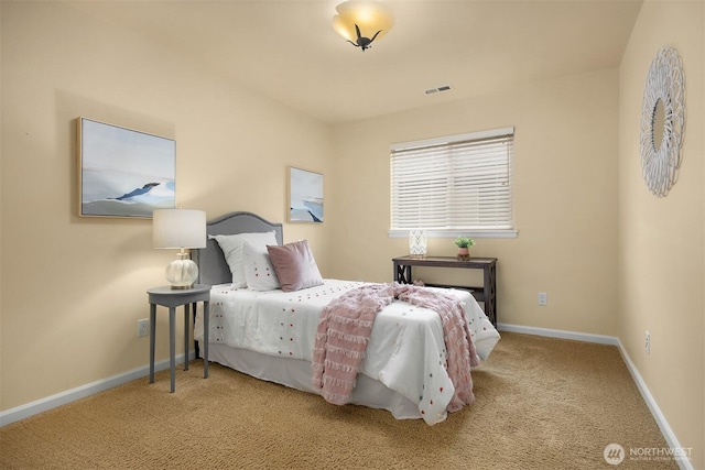 carpeted bedroom with baseboards