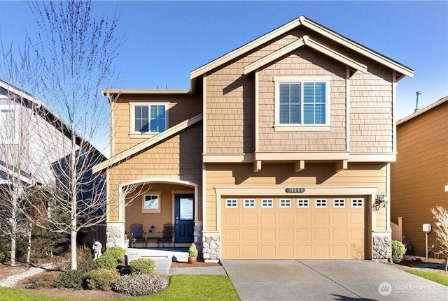 18211 31st Ave SE, Bothell, WA 98012 - craftsman-style house featuring a garage, driveway, and stone siding