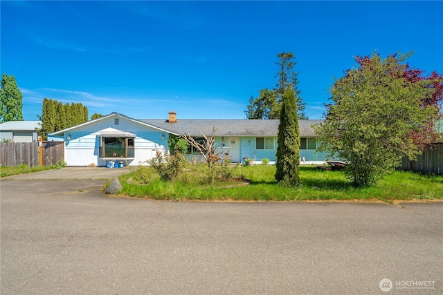 18246 Cinnamon Ln SW, Rochester, WA 98579 - ranch-style home with fence and a chimney