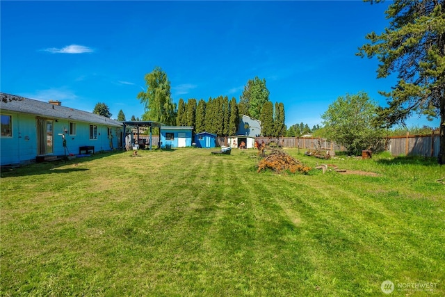 18246 Cinnamon Ln SW, Rochester, WA 98579 - view of yard featuring a storage unit and an outdoor structure