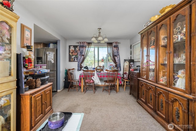 18246 Cinnamon Ln SW, Rochester, WA 98579 - dining area featuring a chandelier and light colored carpet