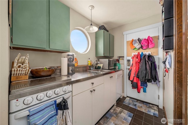 3312 SW 172nd St, Burien, WA 98166 - kitchen featuring stainless steel countertops, stainless steel microwave, oven, a sink, and green cabinetry