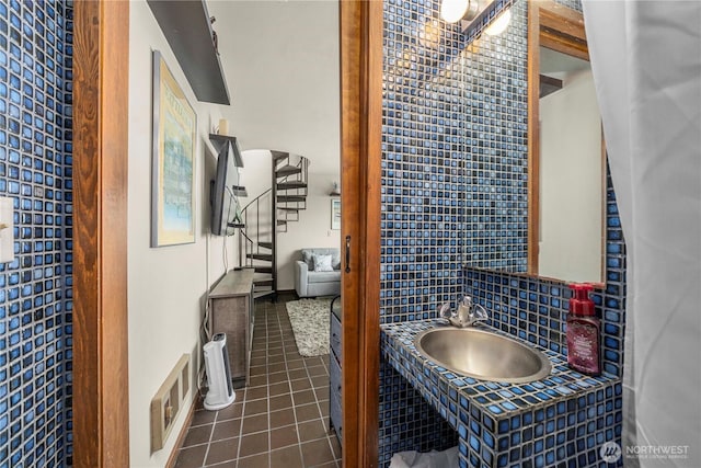 3312 SW 172nd St, Burien, WA 98166 - bathroom featuring tile patterned floors, a sink, and decorative backsplash