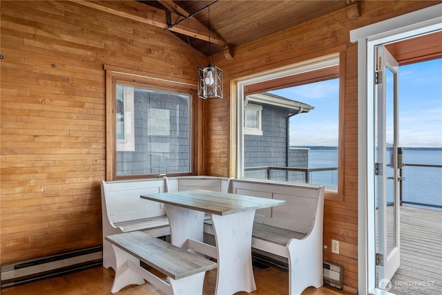 3312 SW 172nd St, Burien, WA 98166 - dining room with a baseboard heating unit, wood ceiling, wood walls, a water view, and wood finished floors