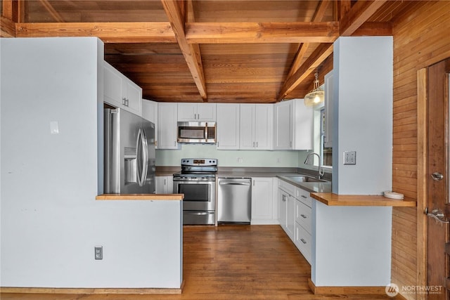 3312 SW 172nd St, Burien, WA 98166 - kitchen featuring appliances with stainless steel finishes, a sink, wood ceiling, beam ceiling, and white cabinetry