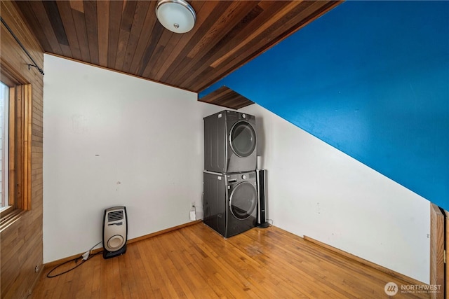 3312 SW 172nd St, Burien, WA 98166 - clothes washing area with stacked washer and clothes dryer, wood-type flooring, wooden ceiling, and baseboards