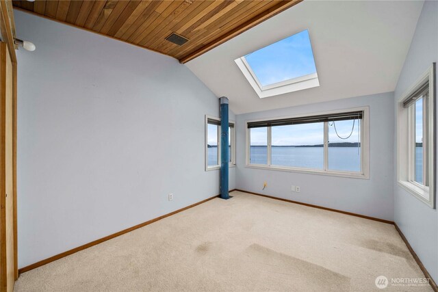 3312 SW 172nd St, Burien, WA 98166 - spare room with a skylight, lofted ceiling, light carpet, plenty of natural light, and wooden ceiling