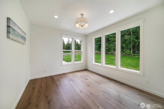 39195 Blackmouth Pl NE, Hansville, WA 98340 - spare room featuring baseboards, hardwood / wood-style flooring, and recessed lighting