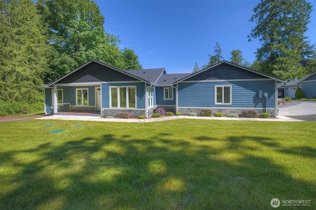 39195 Blackmouth Pl NE, Hansville, WA 98340 - view of front facade featuring a front yard and stone siding