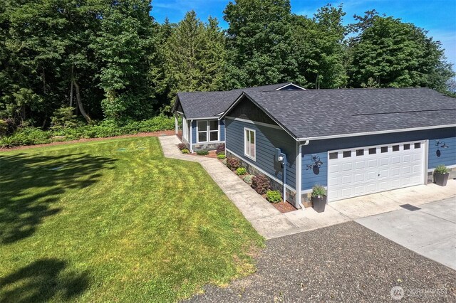 39195 Blackmouth Pl NE, Hansville, WA 98340 - view of front facade featuring a shingled roof, concrete driveway, an attached garage, and a front lawn
