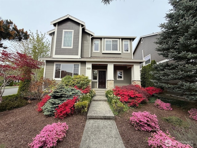 craftsman inspired home with stone siding