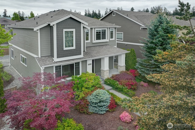 4763 Arbors Cir, Mukilteo, WA 98275 - craftsman house featuring roof with shingles and covered porch