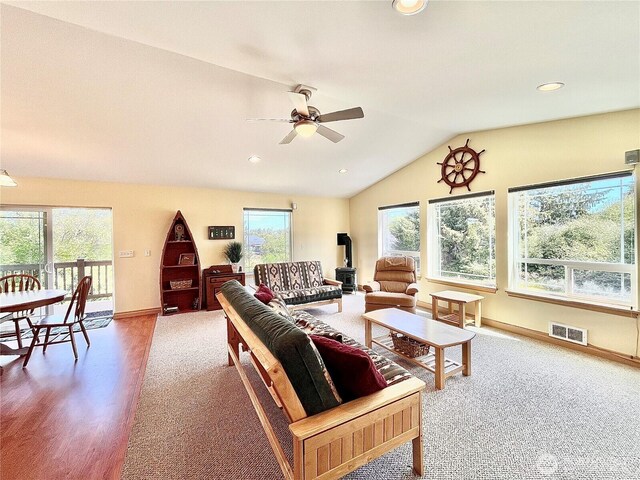 living area with healthy amount of natural light, ceiling fan, lofted ceiling, recessed lighting, and baseboards