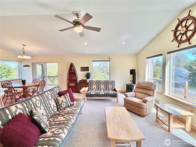 carpeted living room featuring vaulted ceiling, plenty of natural light, recessed lighting, and a ceiling fan