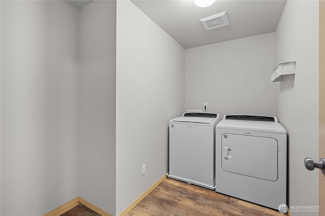 3612 64th St E, Tacoma, WA 98443 - laundry area featuring separate washer and dryer and wood finished floors