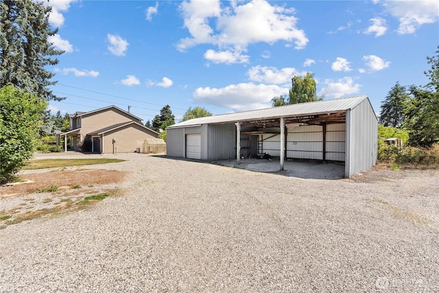 3612 64th St E, Tacoma, WA 98443 - garage featuring gravel driveway and a garage