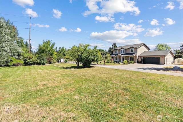 3612 64th St E, Tacoma, WA 98443 - view of grassy yard featuring driveway and a garage