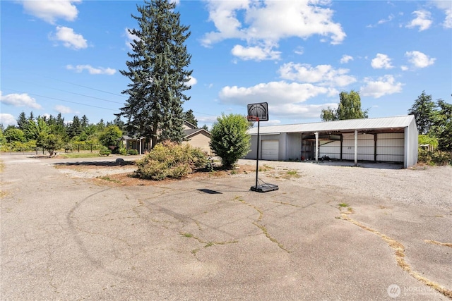 3612 64th St E, Tacoma, WA 98443 - view of vehicle parking with driveway, a garage, and a carport