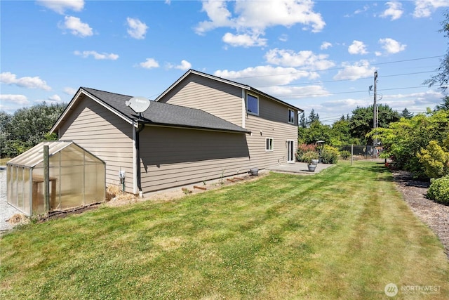 3612 64th St E, Tacoma, WA 98443 - back of house with a greenhouse, a patio, and an outbuilding
