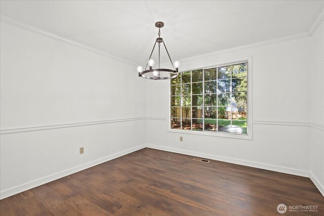 unfurnished dining area with a chandelier, crown molding, baseboards, and dark wood finished floors